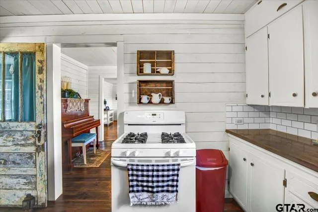 a kitchen with a stove and a sink