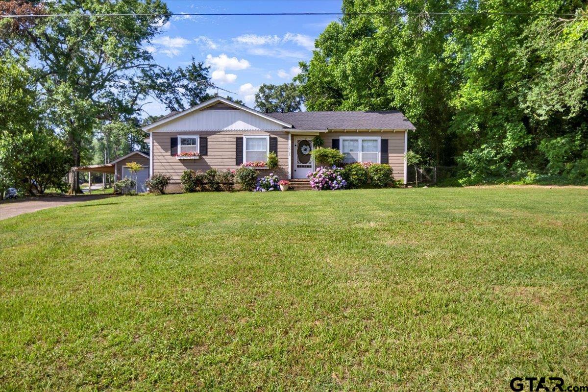 13926 State Highway 64 Tyler, TX 75707 - Photo 3 of 34 a front view of a house with yard and green space
