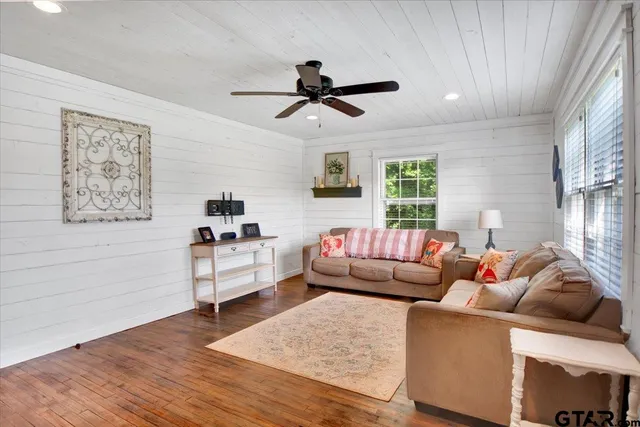 a living room with furniture and a window