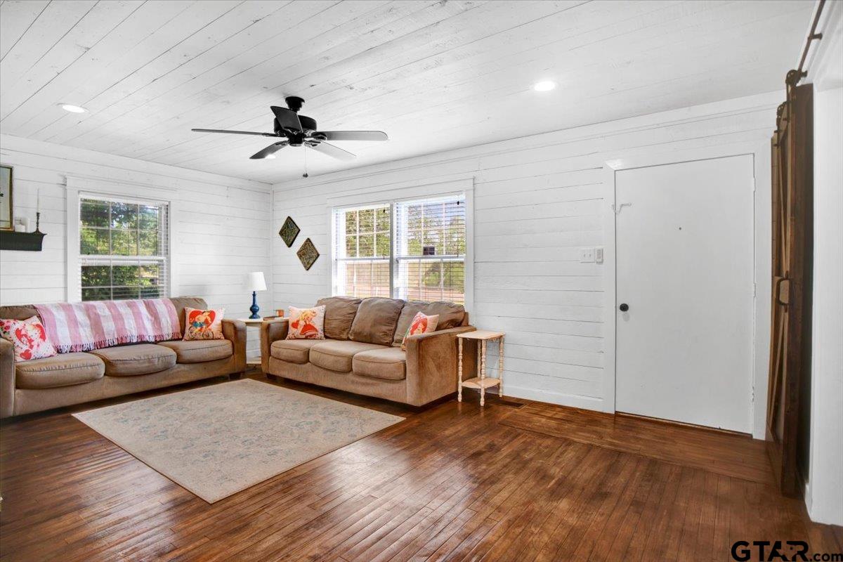 13926 State Highway 64 Tyler, TX 75707 - Photo 8 of 34 a living room with furniture and a wooden floor