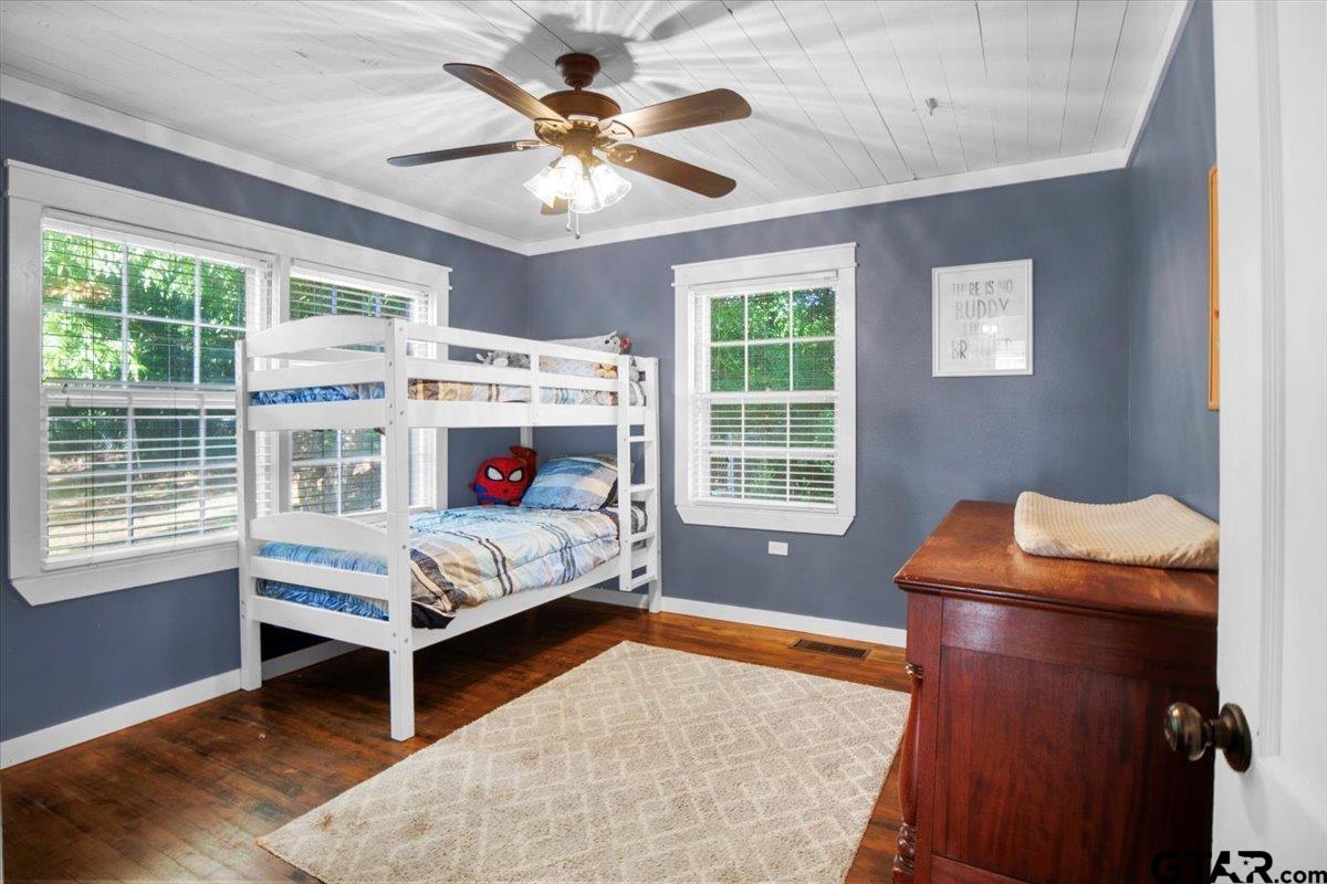 13926 State Highway 64 Tyler, TX 75707 - Photo 9 of 34 a bed room with a bed and a window