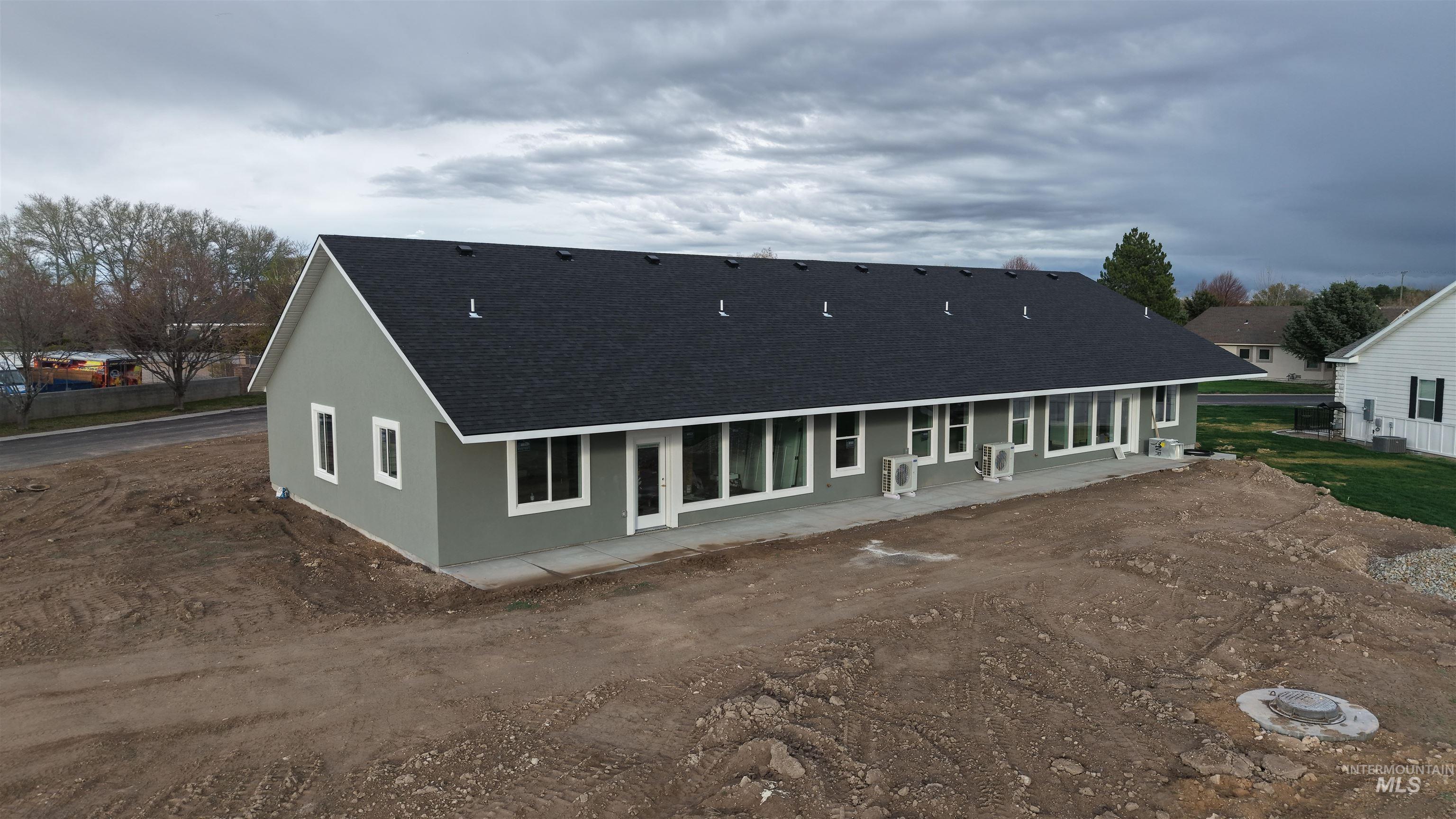 40 Lakeside Loop Burley, ID 83318 - Photo 15 of 15 Back of property with roof with shingles, a patio, and stucco siding