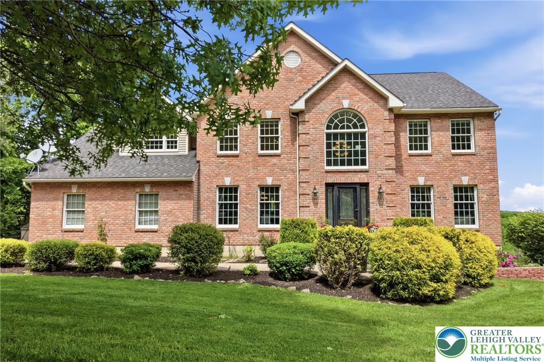 115 West Butternut Road Hellertown, PA 18055 - Photo 4 of 97 An inviting brick facade with meticulously manicured shrubs welcomes you home.