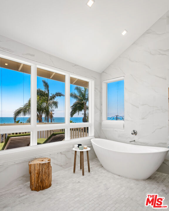 25157 Malibu Road Malibu, CA 90265 - Photo 16 of 33 a spacious bathroom with a tub and a large window