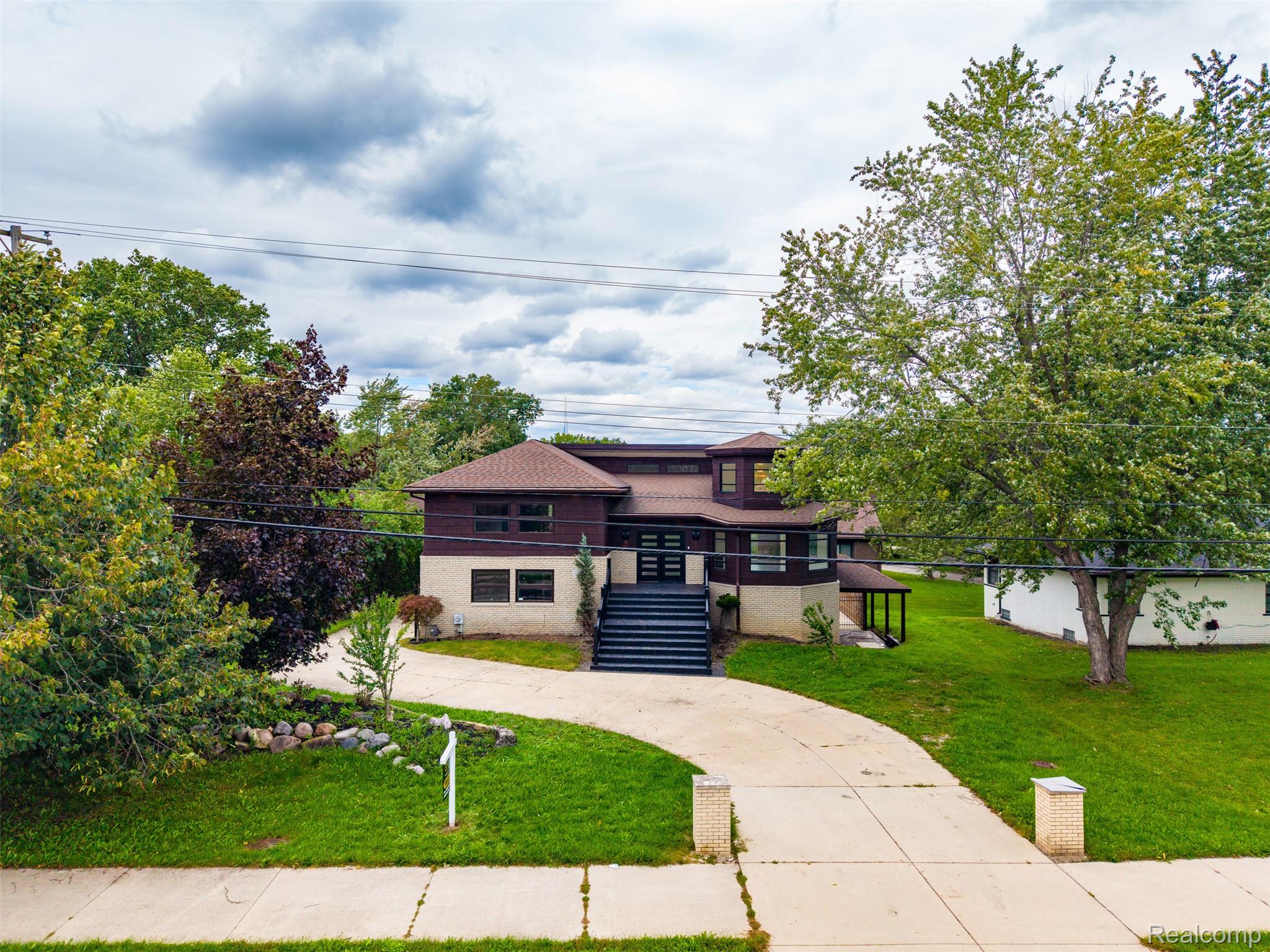 27507 Bell Road Southfield, MI 48034 - Photo 60 of 81 Multi-level exterior with dark siding and light-colored lower-level facade