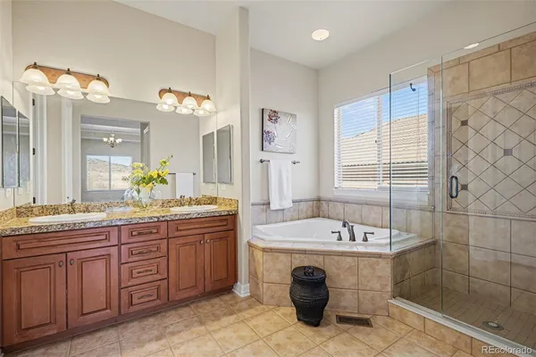 a bathroom with a tub and shower