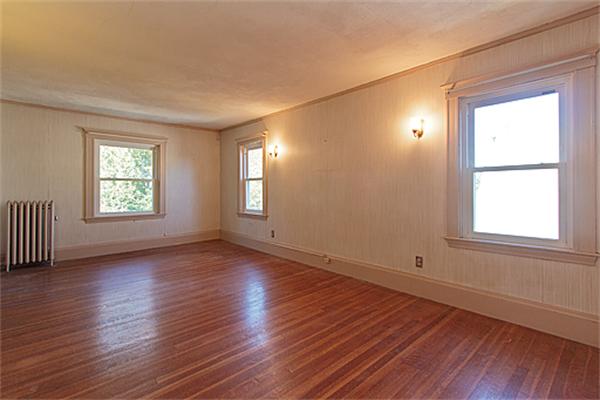 60 Robbins Road Arlington, MA 02476 - Photo 14 of 22 an empty room with wooden floor and windows