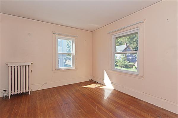 60 Robbins Road Arlington, MA 02476 - Photo 17 of 22 an empty room with wooden floor and windows