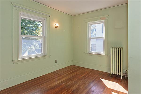 60 Robbins Road Arlington, MA 02476 - Photo 18 of 22 an empty room with wooden floor and windows