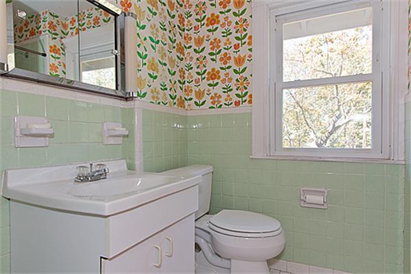 60 Robbins Road Arlington, MA 02476 - Photo 19 of 22 a bathroom with a sink a toilet and a window