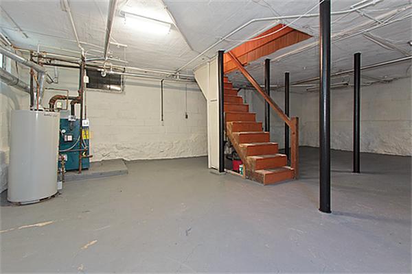 60 Robbins Road Arlington, MA 02476 - Photo 22 of 22 a view of a room with wooden floor and stairs