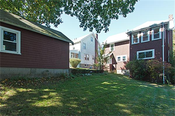 60 Robbins Road Arlington, MA 02476 - Photo 4 of 22 a backyard of a house with plants and large tree