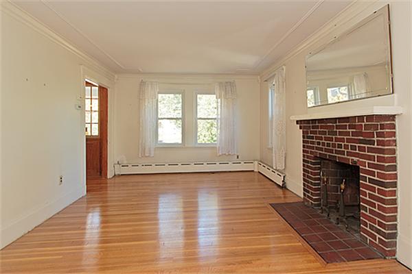 60 Robbins Road Arlington, MA 02476 - Photo 7 of 22 an empty room with wooden floor and windows