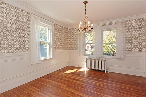 60 Robbins Road Arlington, MA 02476 - Photo 9 of 22 an empty room with wooden floor and windows