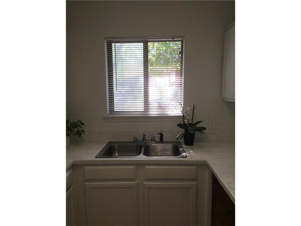 5550 Spring Valley Road, Unit G12 Dallas, TX 75254 - Photo 6 of 13 a bathroom with a sink and a window