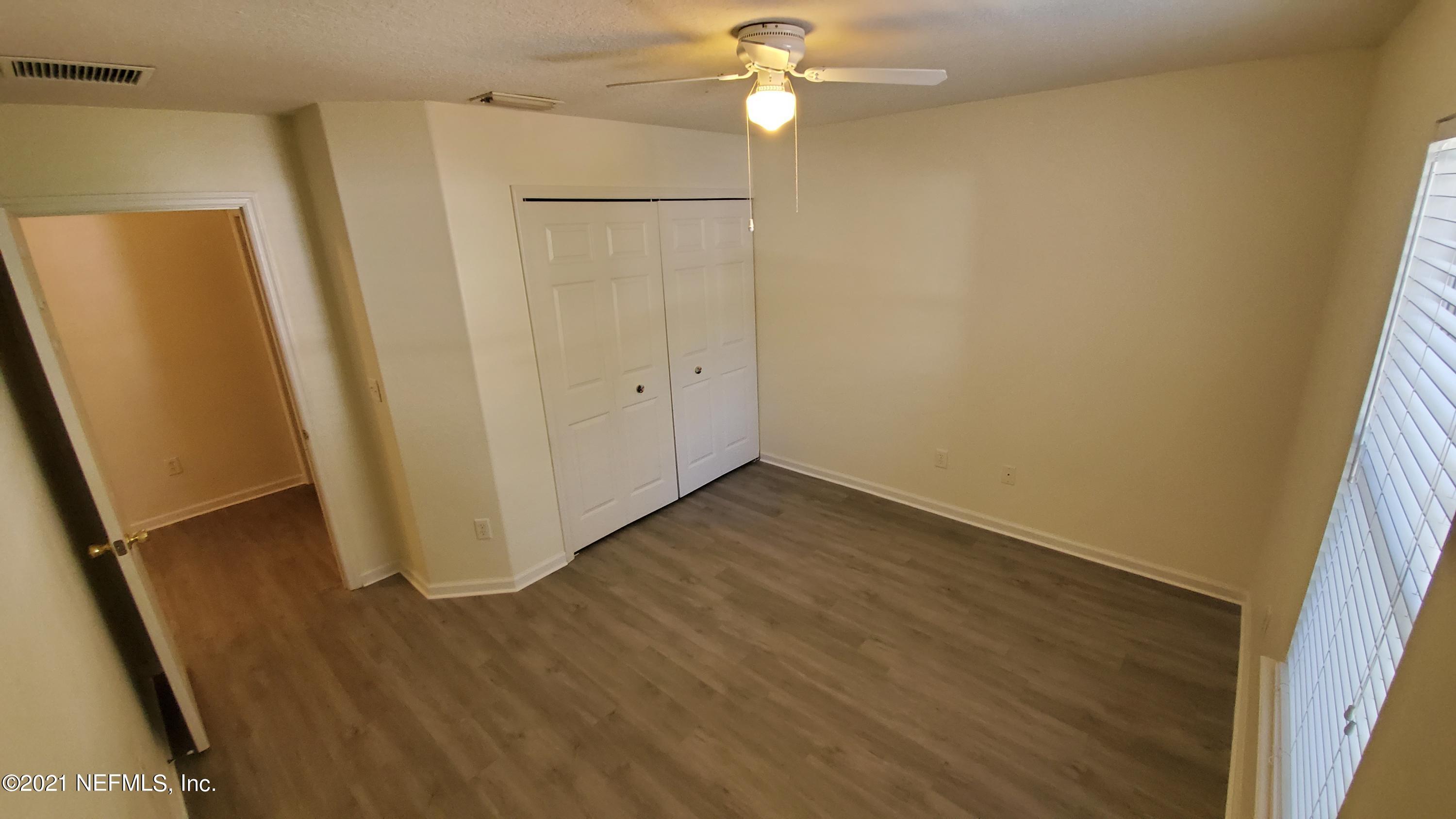 658 MacKenzie Circle St. Augustine, FL 32092 - Photo 11 of 13 a view of a hallway with wooden floor