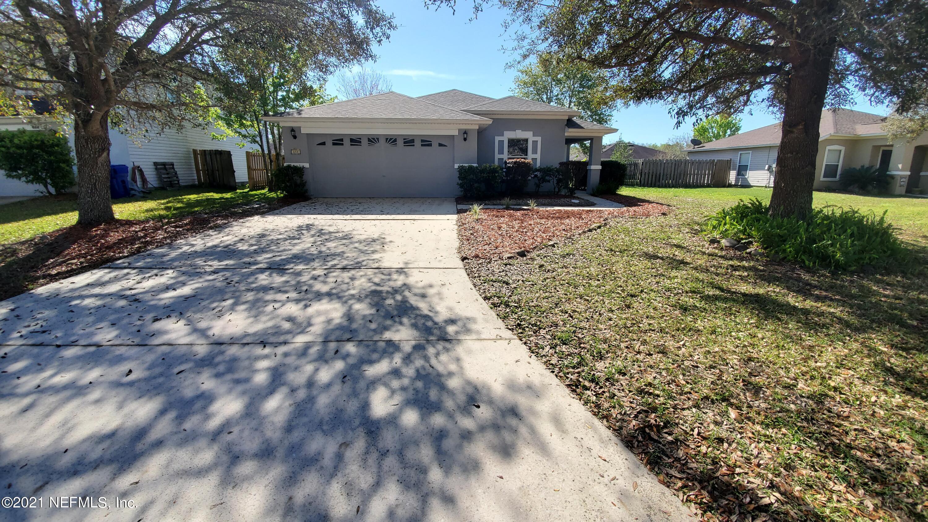658 MacKenzie Circle St. Augustine, FL 32092 - Photo 2 of 13 a view of a house with a yard