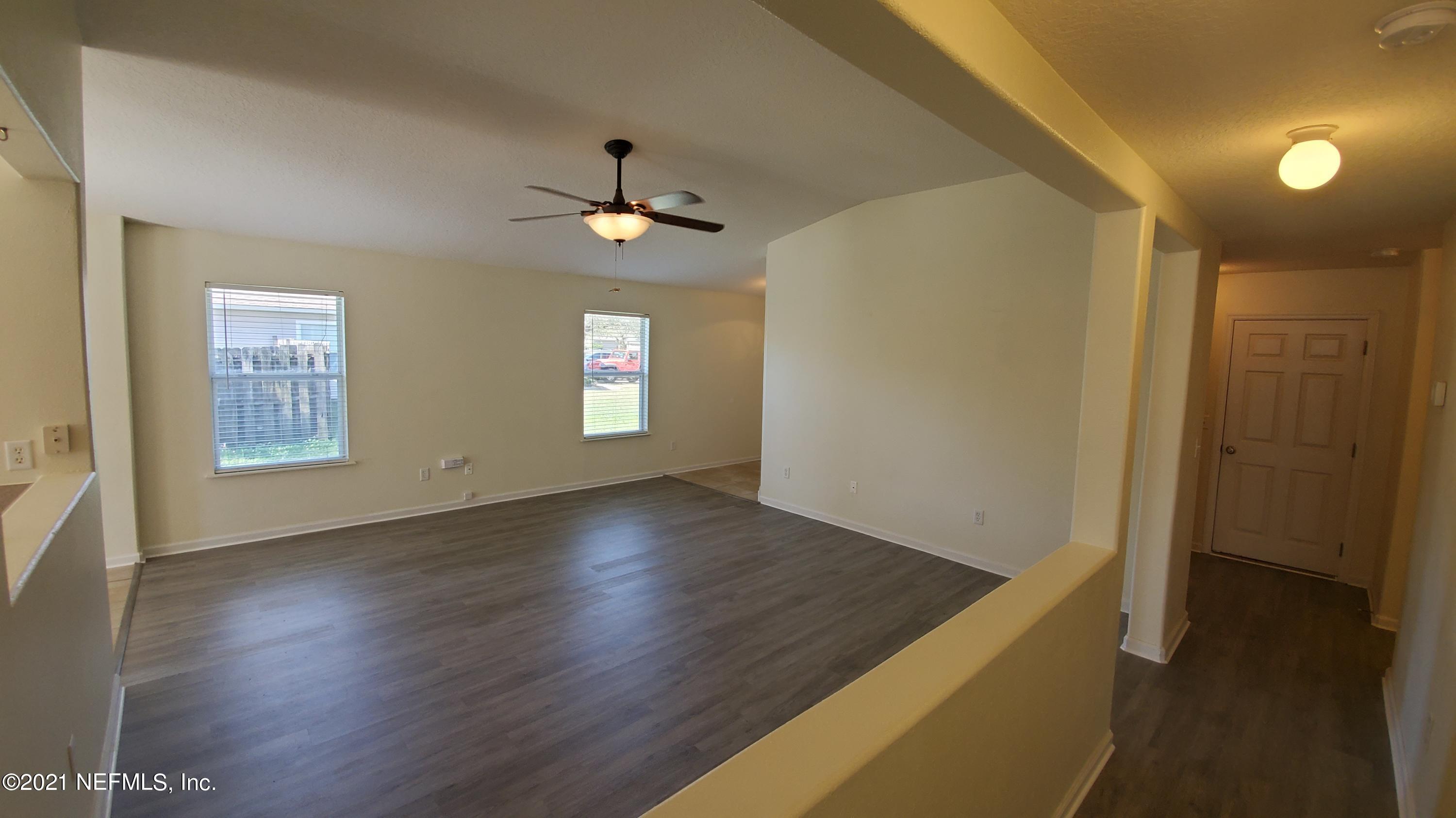 658 MacKenzie Circle St. Augustine, FL 32092 - Photo 8 of 13 a view of empty room with wooden floor and fan