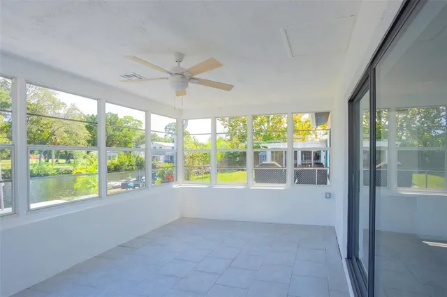 a view of an empty room with a large window