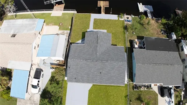 an aerial view of residential house with outdoor space and swimming pool