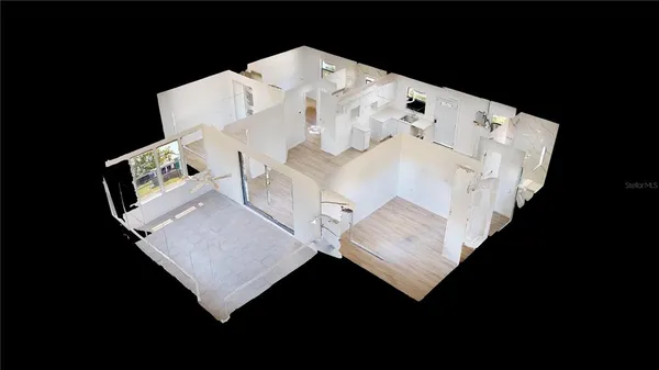 a white bed sitting in a bedroom next to a white cabinet