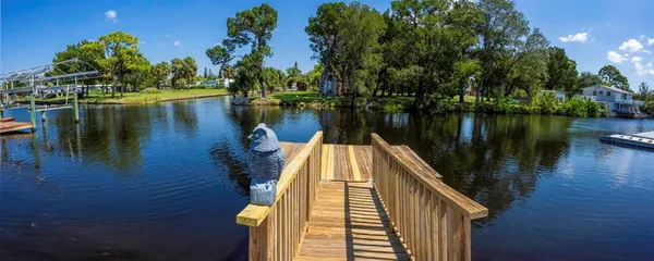 a view of a lake with a house in the background