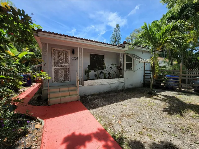 a view of a house with a couches in the patio