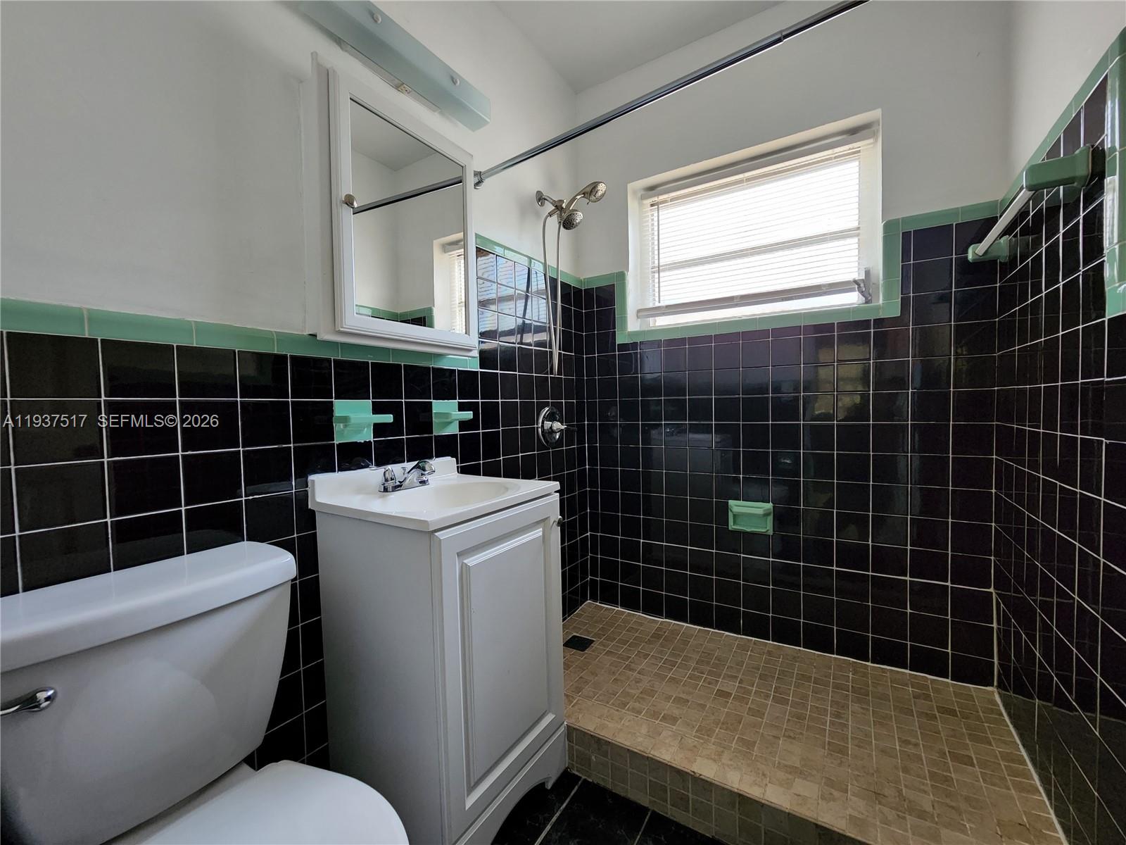 8335 Northeast 3rd Avenue, Unit 1 Miami, FL 33138 - Photo 10 of 12 a bathroom with a sink toilet and shower