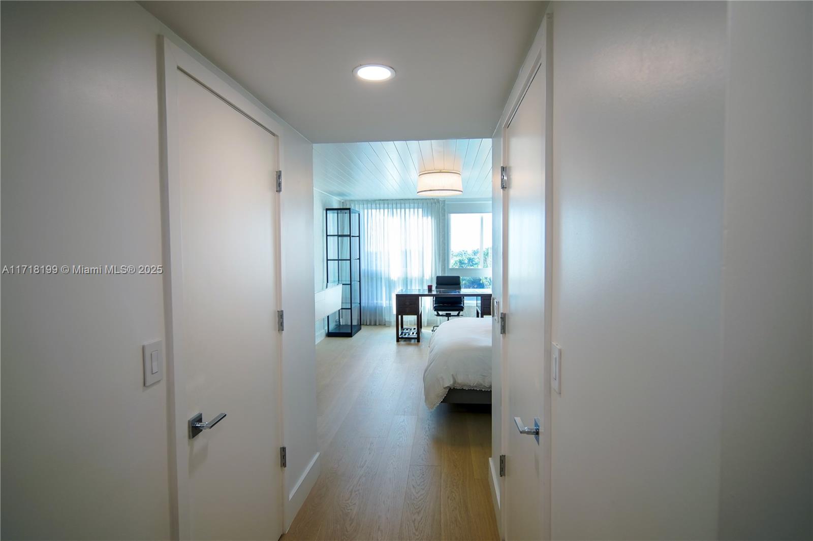 765 Crandon Boulevard, Unit 510 Key Biscayne, FL 33149 - Photo 18 of 28 a view of a hallway with livingroom and furniture
