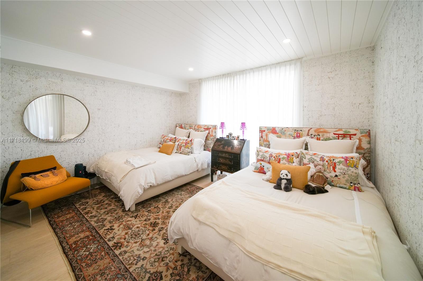 765 Crandon Boulevard, Unit 510 Key Biscayne, FL 33149 - Photo 25 of 28 a bedroom with two beds and a couch