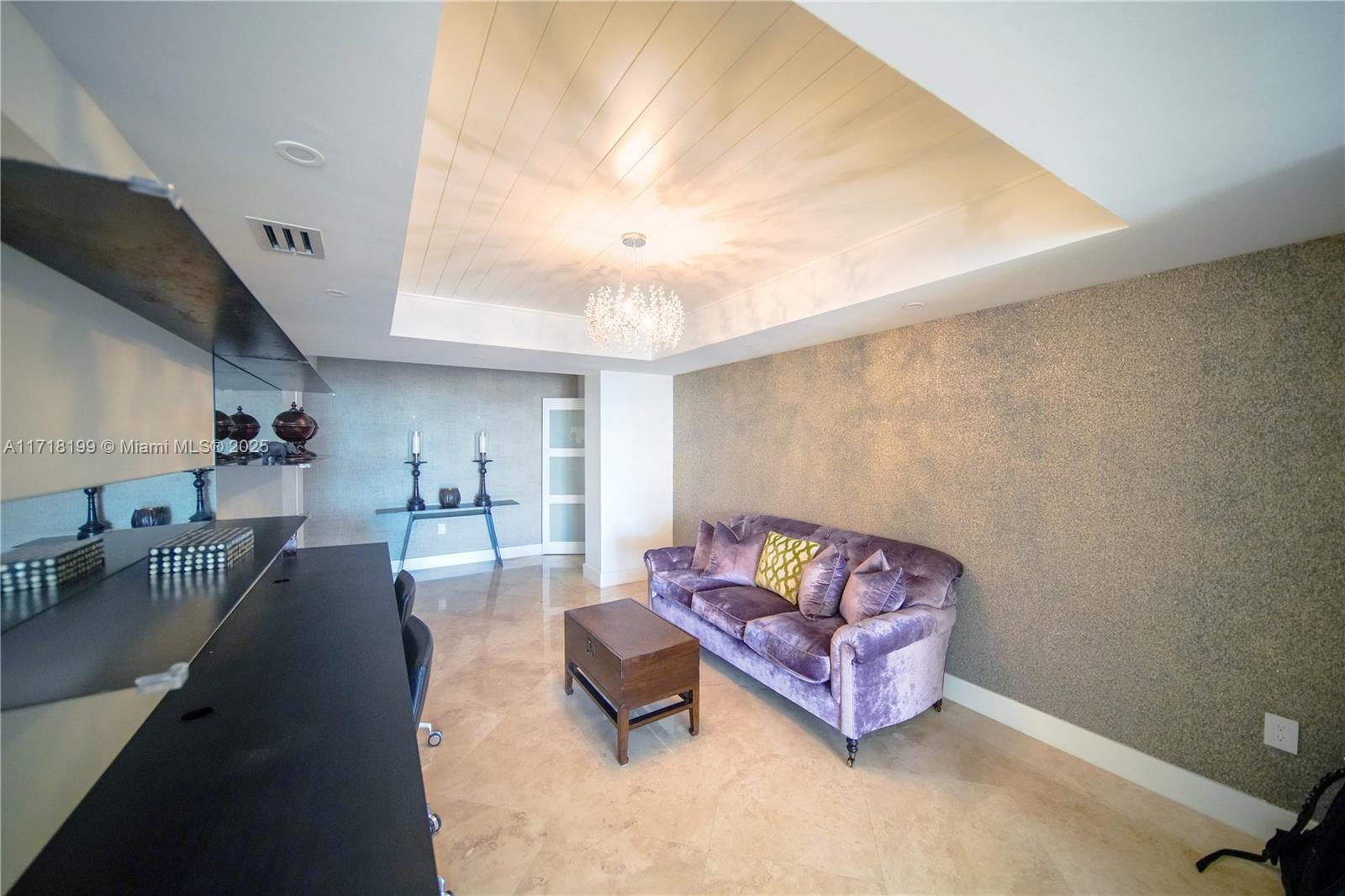 765 Crandon Boulevard, Unit 510 Key Biscayne, FL 33149 - Photo 3 of 28 a living room with furniture and a couch