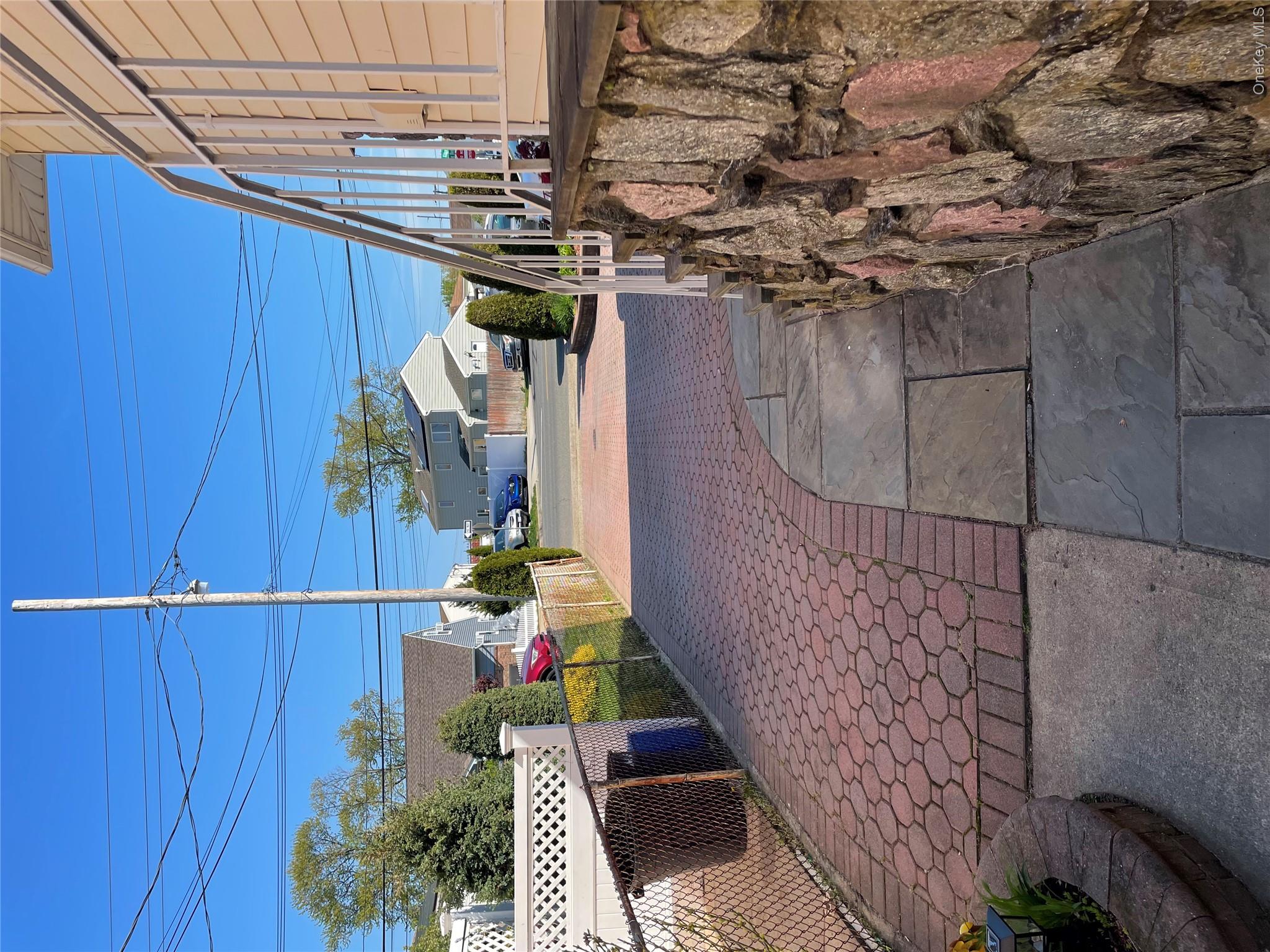 554 Long Beach Road Island Park, NY 11558 - Photo 1 of 10 Private Side Entrance With One Car Driveway Parking