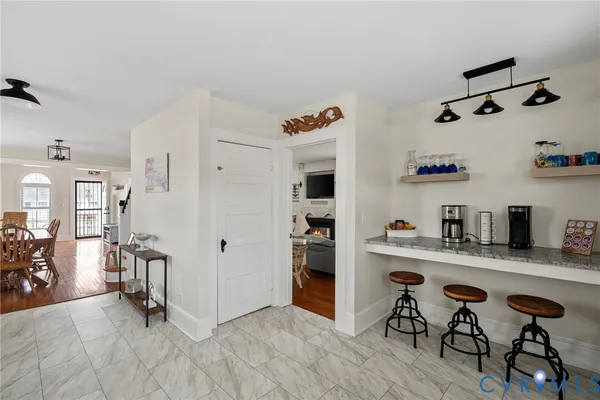a view of kitchen with furniture and wooden floor