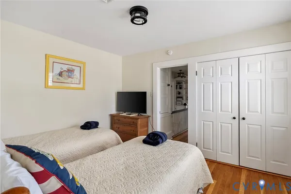 a bedroom with bed and a tv