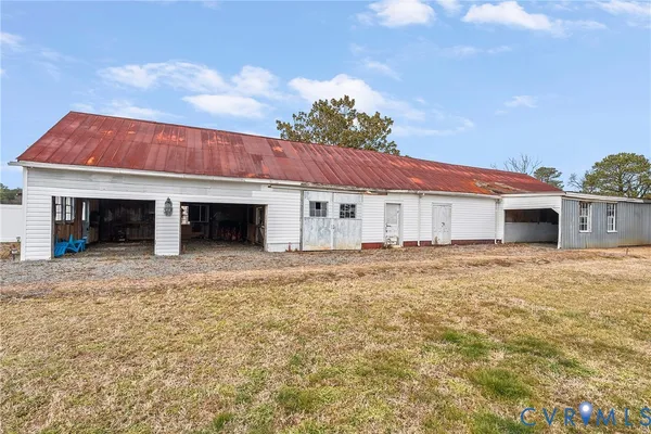 a front view of a house with a yard and a garage