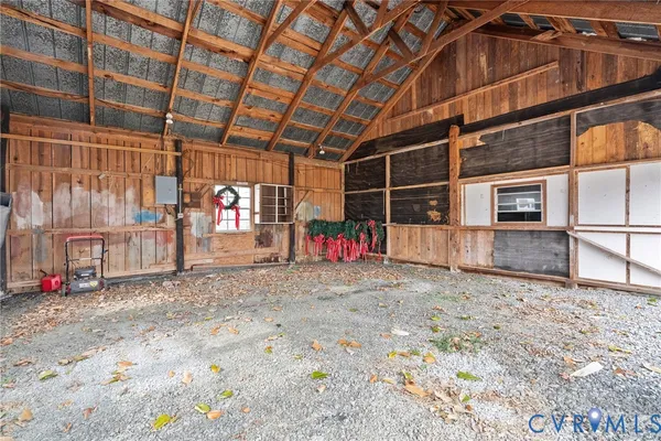a view of a big room with wooden roof