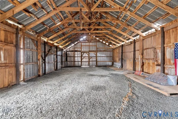 a view of an empty room with a staircase