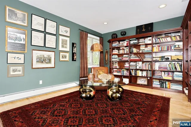 a room with furniture and book shelf