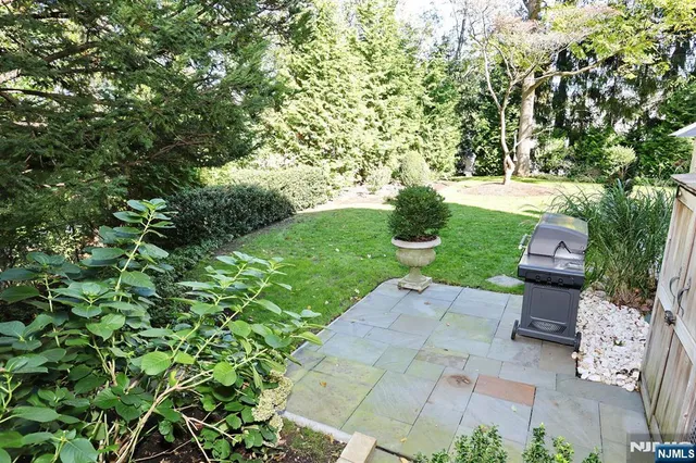 a view of backyard with outdoor seating