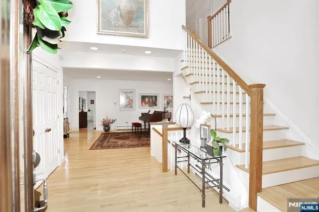 a view of an entryway with wooden floor