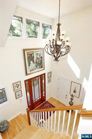 a view of a livingroom with furniture and staircase
