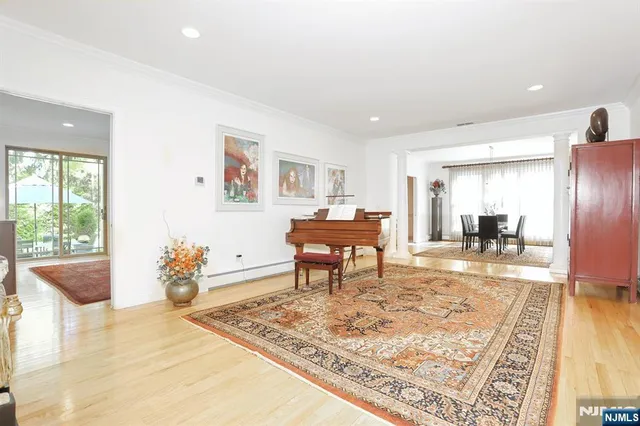a living room with furniture and a rug
