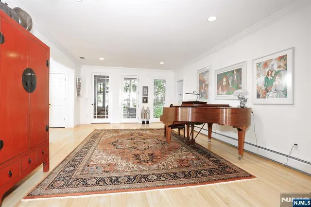 a living room with furniture and a rug