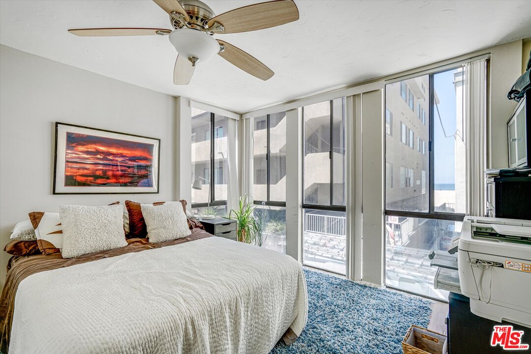 14 Mast Street Marina del Rey, CA 90292 - Photo 18 of 56 a bedroom with a large bed and a flat tv screen