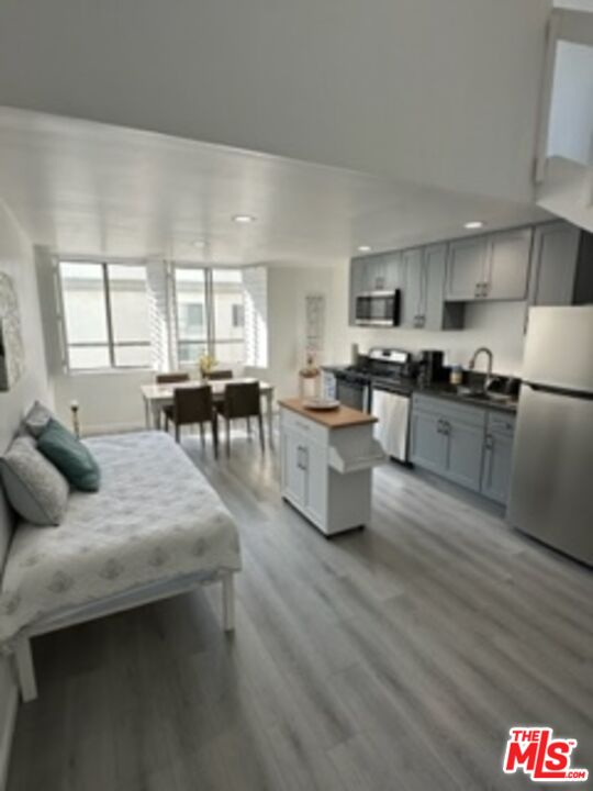 14 Mast Street Marina del Rey, CA 90292 - Photo 41 of 56 a living room with furniture and kitchen with wooden floor