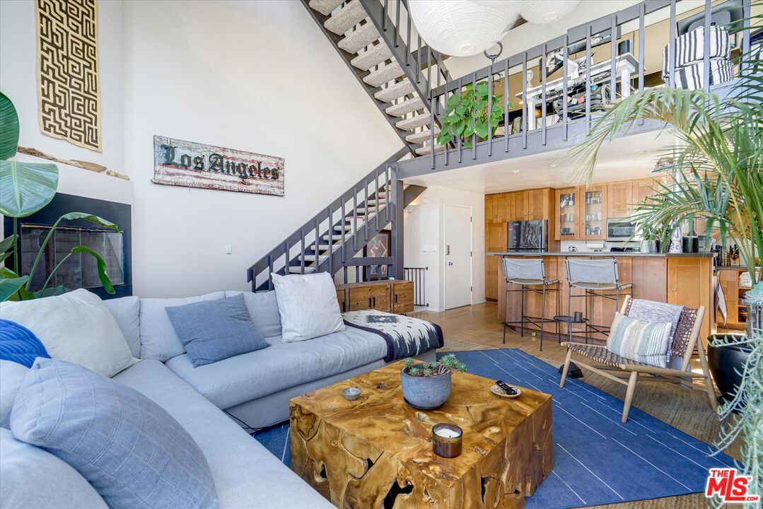 14 Mast Street Marina del Rey, CA 90292 - Photo 5 of 56 a living room with furniture and a chandelier