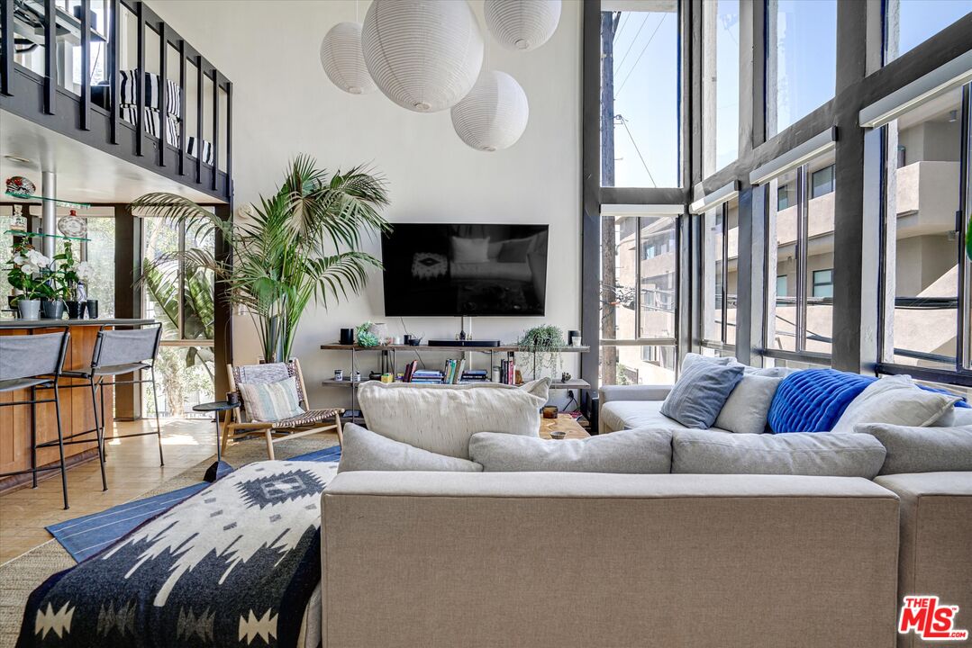 14 Mast Street Marina del Rey, CA 90292 - Photo 6 of 56 a living room with furniture and a flat screen tv