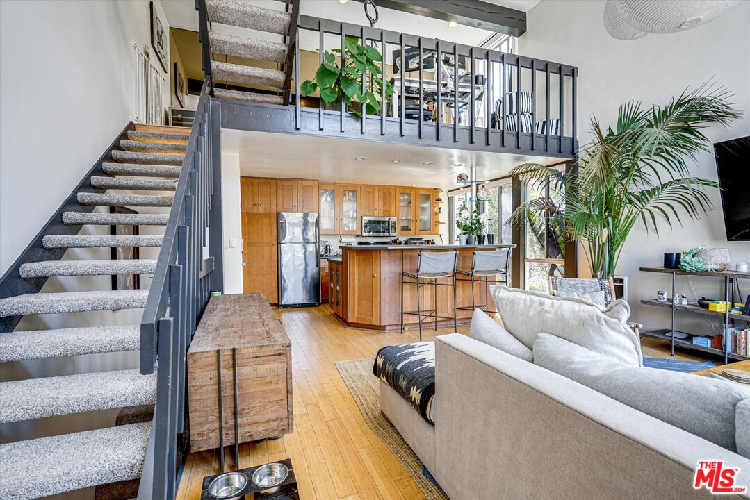 14 Mast Street Marina del Rey, CA 90292 - Photo 7 of 56 a living room with furniture and a chandelier