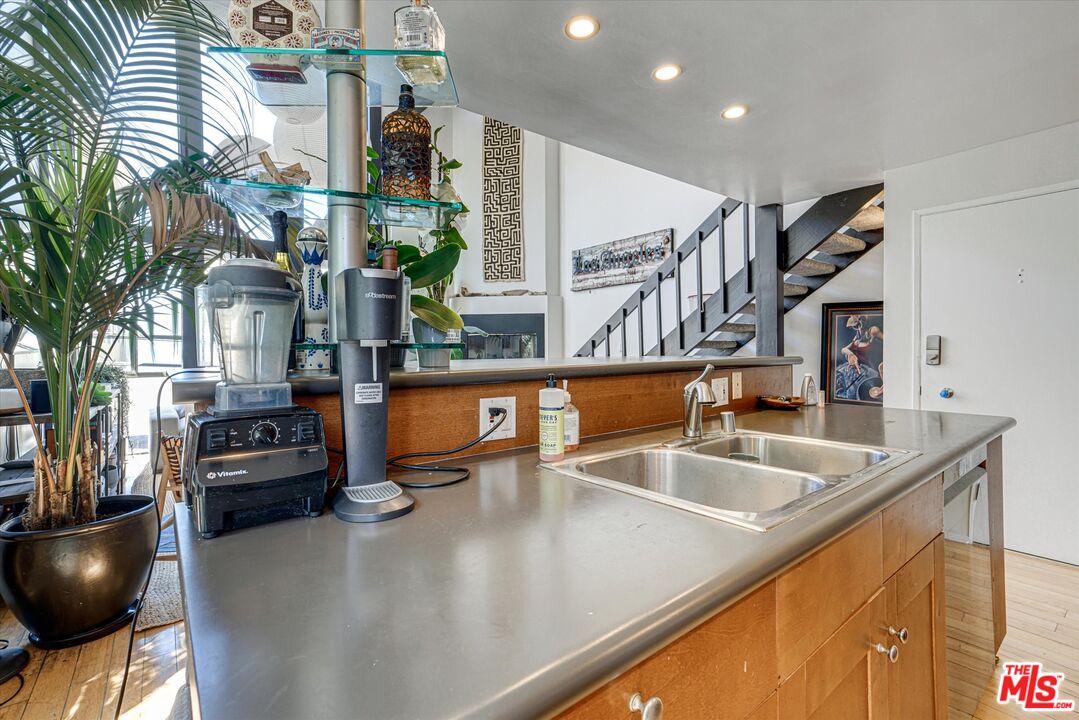 14 Mast Street Marina del Rey, CA 90292 - Photo 8 of 56 a kitchen with stainless steel appliances granite countertop a sink and a refrigerator