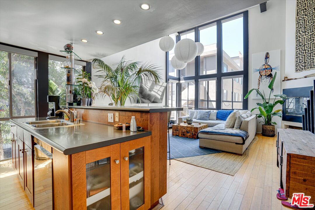 14 Mast Street Marina del Rey, CA 90292 - Photo 10 of 56 a living room with furniture kitchen view and large windows